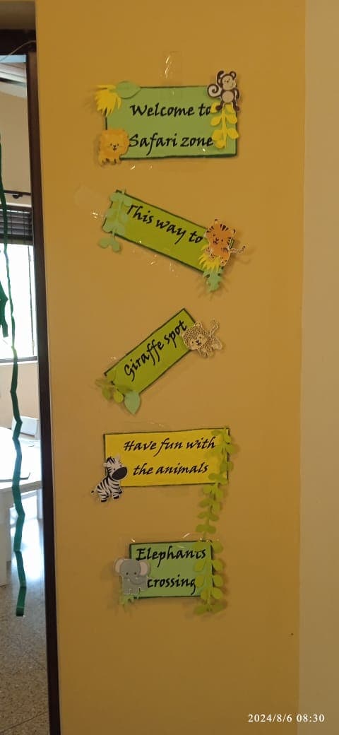 Safari-themed signs on a wall