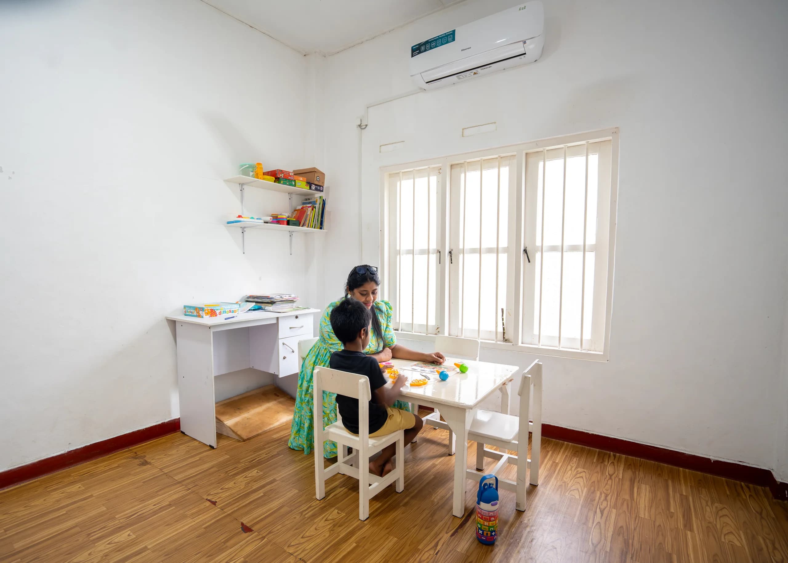 Speech therapist guiding a child through play