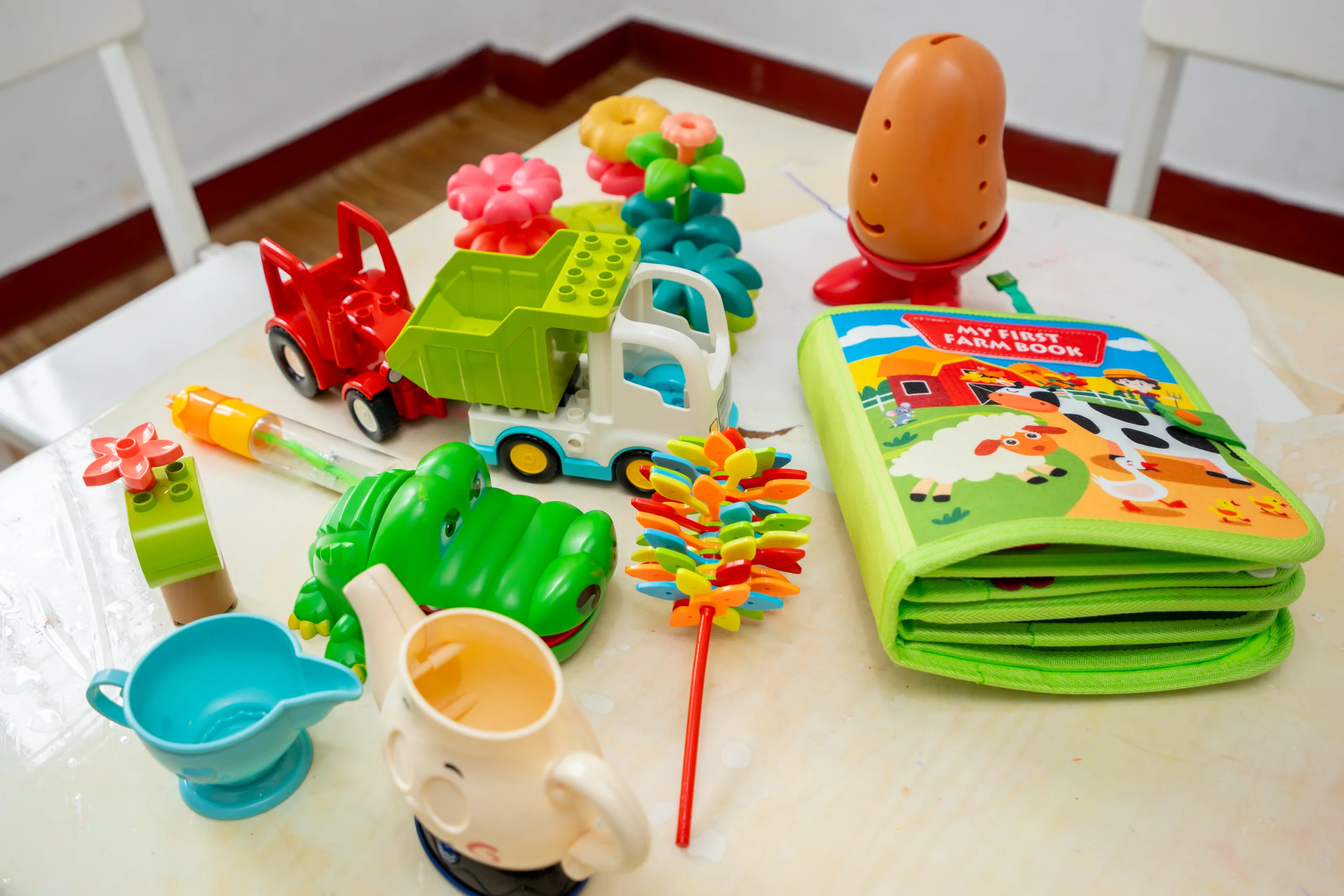 Shelves of therapy and learning toys used in sessions
